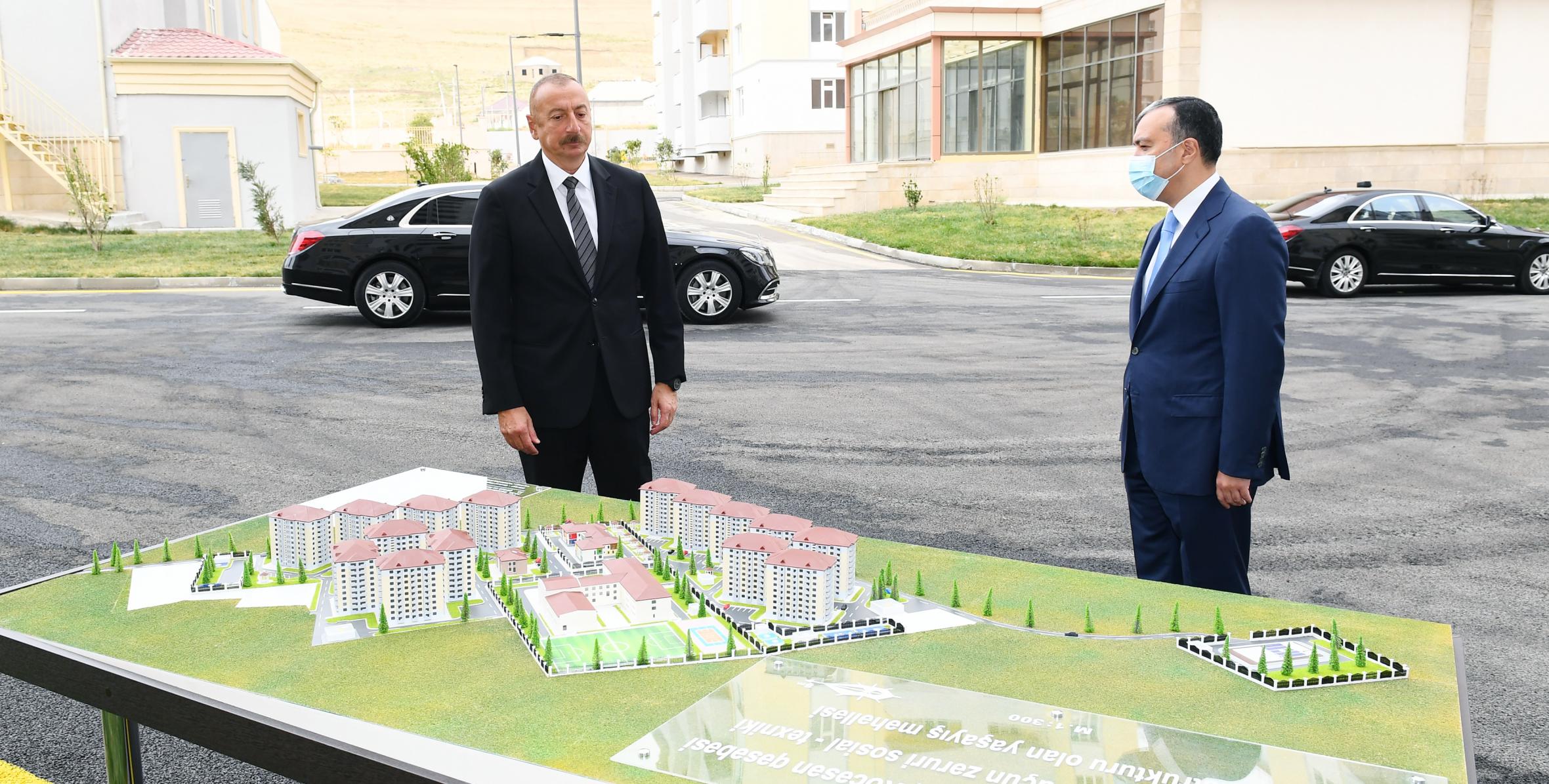 Ilham Aliyev attended the ceremony to give out apartments and cars to families of martyrs and war disabled in the Khojasan settlement
