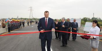 Ilham Aliyev attended a ceremony to open a bridge built over a new tributary of the Aras river