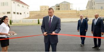 Ilham Aliyev attended the opening of a newly-built secondary school No 329 and a kindergarten