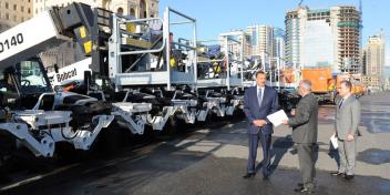 Ilham Aliyev reviewed different newly-delivered transport vehicles providing utility services