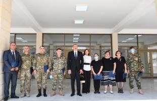 Ilham Aliyev and First Lady Mehriban Aliyeva attended the ceremony to give out apartments and cars to families of martyrs, war disabled and heroes of the Patriotic War in Absheron district