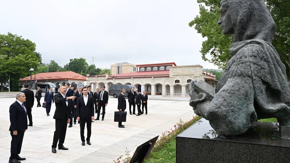 Ilham Aliyev and Serdar Berdimuhamedov view bullet-riddled busts of Azerbaijan’s prominent figures in Shusha